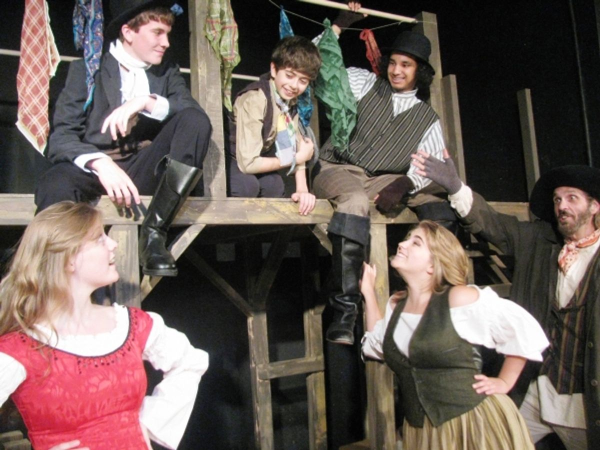 Fagin (DeLarme Landes, far right) introduces Oliver (Adam Juraga, center) to Nancy (Tess Ammerman, bottom left) and Bet (Dana Maginity, bottom right) and two members of the gang (Michael O'Hara, top left, and Isaiah Davis, top right) at 