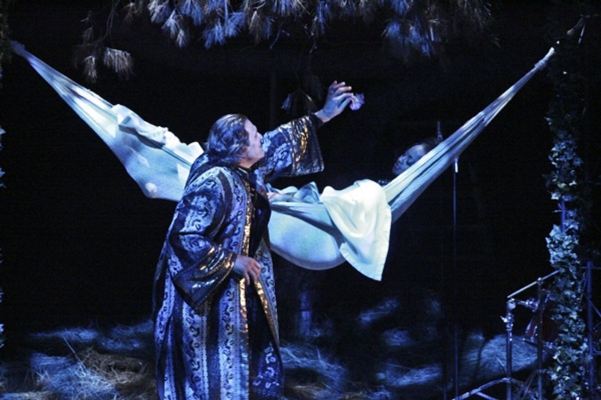 Oberon (Paul Perri) anoints Titania's (Tracey A. Leigh) eyes with flower essence at 