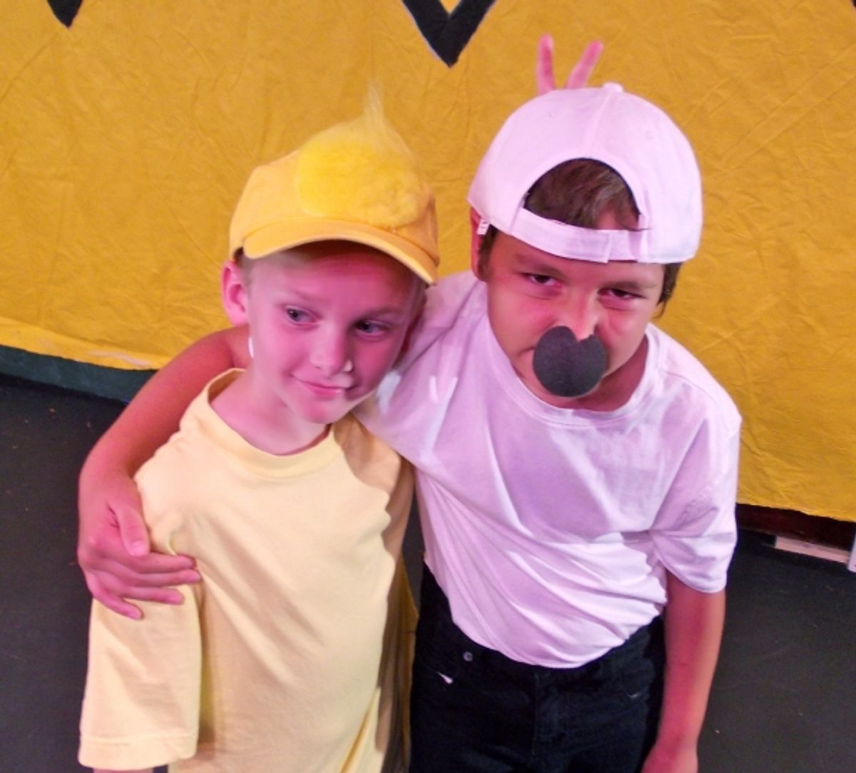 Collin George as Woodstock and Miles Synder as Snoopy at 
