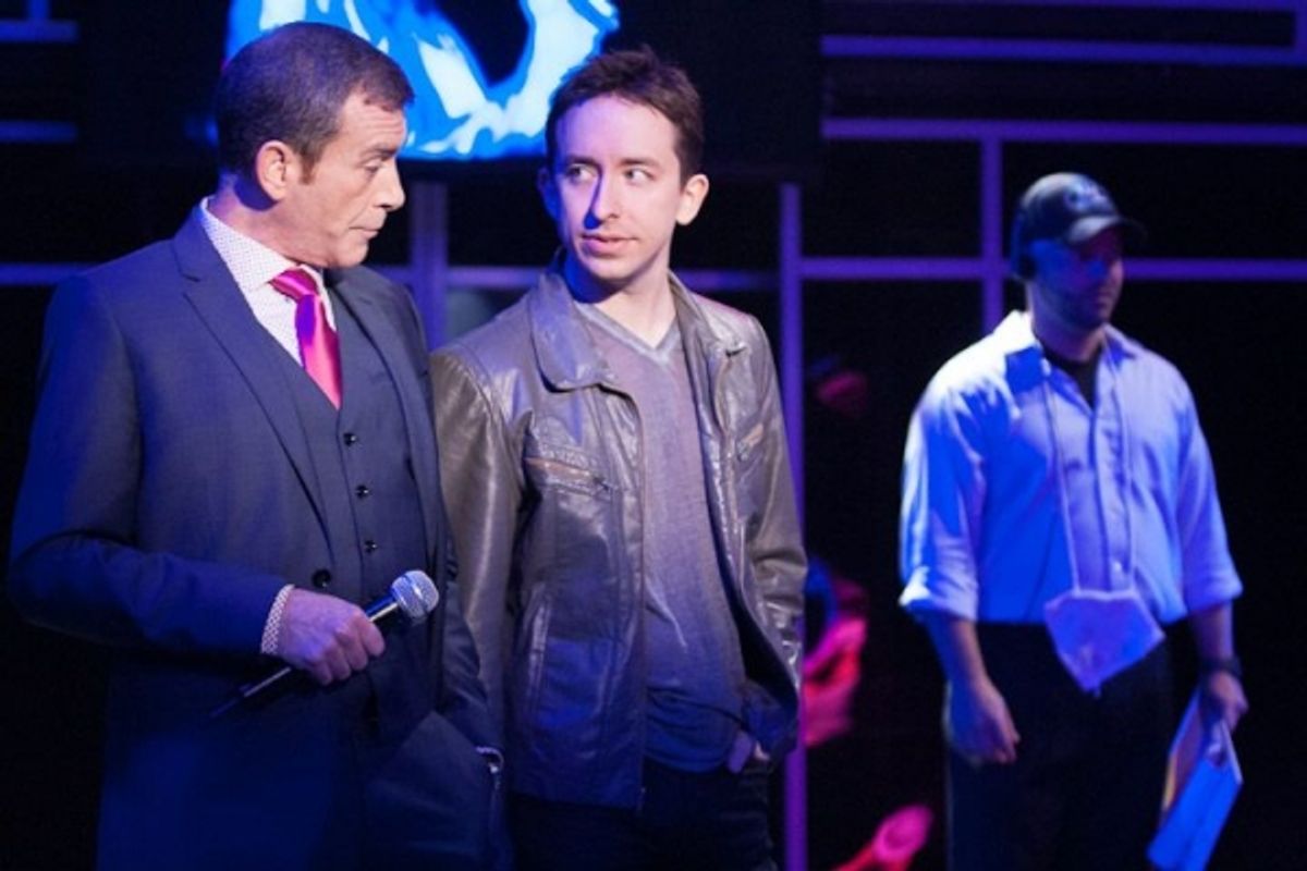 Television hosts Richard Riddle (Bobby Smith, left) and Evan Peterson (James Gardiner, center) strain to keep their competitive streaks under wraps at 