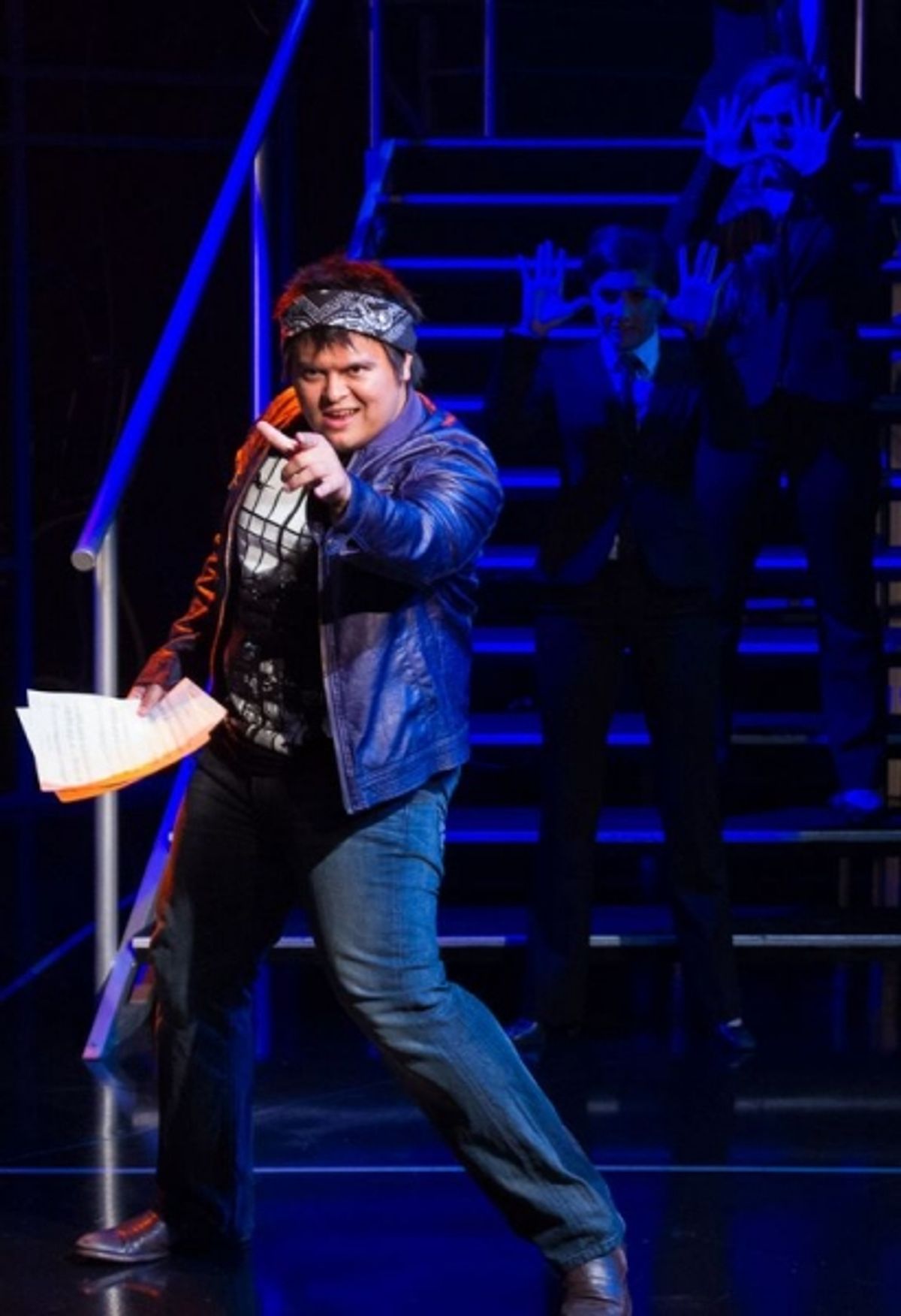 Television show contestant Dylan (Christopher Mueller) rocks out  at 