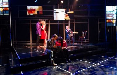 Danny and Makalo (Stephen Russell Murray and Carolyn Cole, foreground) share a quiet  Photo