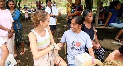 Monika Rofler interacts with one of the lamps'' beneficiaries Photo