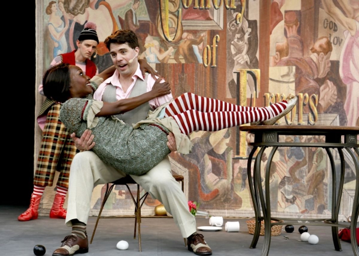 Mistaking him for her husband, Lanise Antoine Shelley as Adriana seduces Paul Hurley as Antipholus of Syracuse while Sam Taylor, as his confused servant Dromio of Syracuse, looks on at 