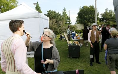 CST Wig and Make-up Designer, Melissa Veal does a final touch-up on Paul Hurley Photo