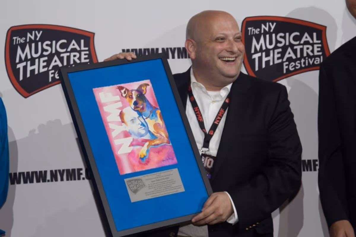 Issac Robert Hurwitz accepts a special gift for recognition of 10 years of being Executive Director and Producer of the New York Musical Theatre Festival at NYMF Celebrates 2013 Awards for Excellence, Closing Night