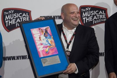 Issac Robert Hurwitz accepts a special gift for recognition of 10 years of being Exec Photo