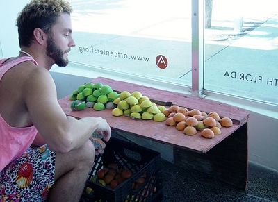 Miami artist Johnny Laderer installing his artwork Photo