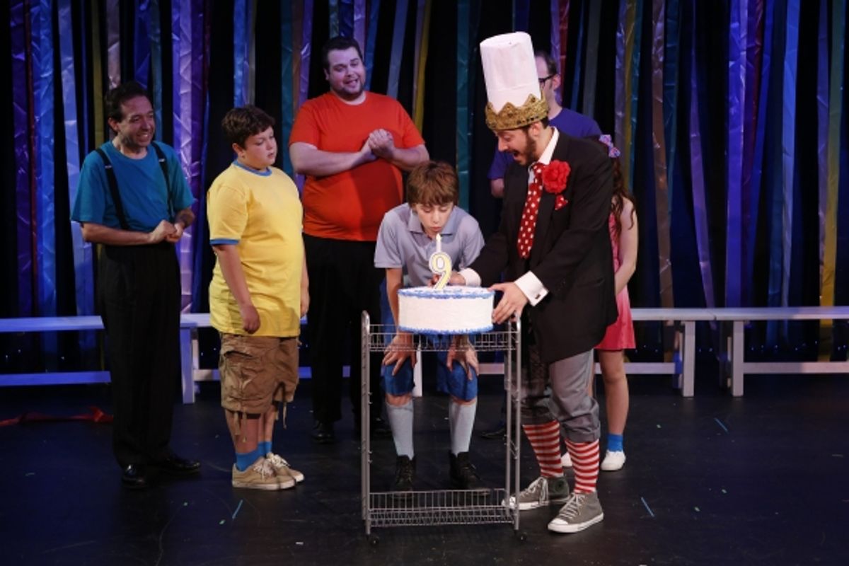 Timmy (Cormac Cullinane) blows out birthday candles as his father  King Edward the Sensible (Jason Pintar) and friends celebrate his special day. at 