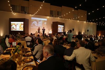 Laurie Lang, CEO, Project Angel Food, and Emmy-nominee, Dan Bucatinsky on stage condu Photo