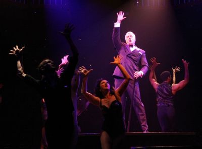 Tom Hewitt (Billy Flynn) and ensemble Photo
