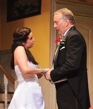 Stanley Banks (Jeff Stockberger) reassures his emotional daughter, Kay (Lisa Ermel),  Photo