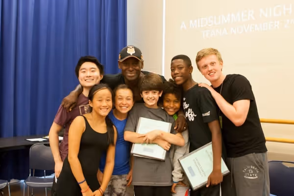 Oberon surrounded by his Rude Elementals. David Harewood (back row center) with (left Photo
