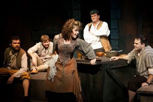 Boni Hester (Center) as Aldonza and (from left) Stephen Mercantel, Paul Koudouris, Br Photo