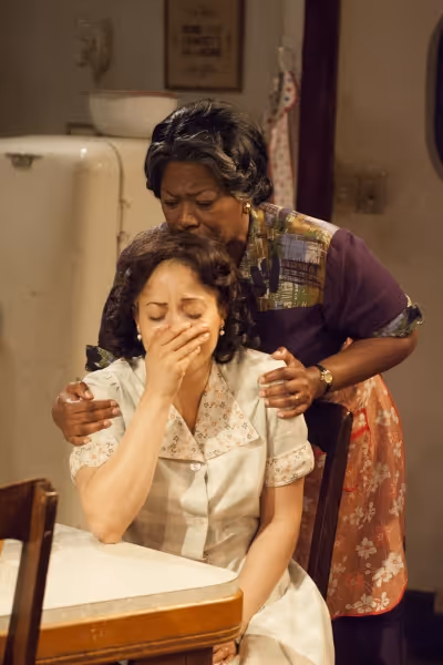 Lena ''Mama'' Younger (Greta Oglesby, right) comforts Ruth Younger (Toni Martin, left Photo