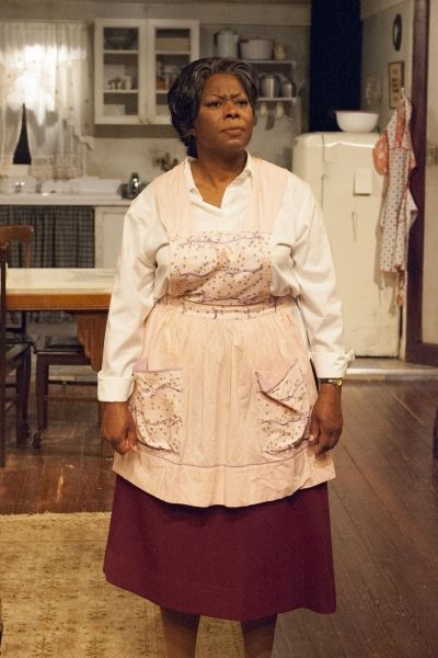 Lena 'Mama' Younger (Greta Oglesby) works to hold her family together and give them a Photo