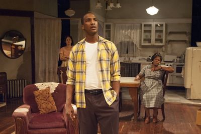 Walter Lee Younger (Jerod Haynes, center) dreams of a better life for his family, inc Photo