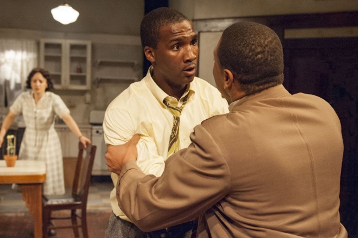 Walter Lee Younger (Jerod Haynes, center) sees his dreams of a better life with his wife Ruth (Toni Martin, left) slipping away after his friend Bobo (Wardell Julius Clark) brings bad news. at 