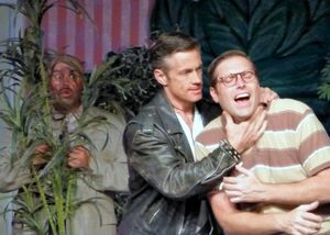 Mushnik overhears Orin trying to convince Seymour to leave his flower shop. from left: Peter Miller, Randy Brown, Brett Chapin @ BroadwayWorld Mushnik overhears Orin trying to convince Seymour to leave his flower shop. from left Photo