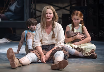 Beatriz (ensemble member Joan Allen, center) is exasperated by The Boy (Daniel Pass,  Photo