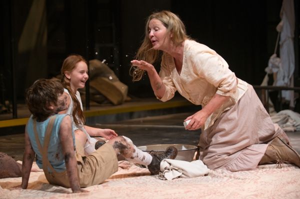 Beatriz (ensemble member Joan Allen) shares the soap she just purchased with The Girl Photo