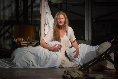 Beatriz (ensemble member Joan Allen) embraces two familiar dead bodies  Photo