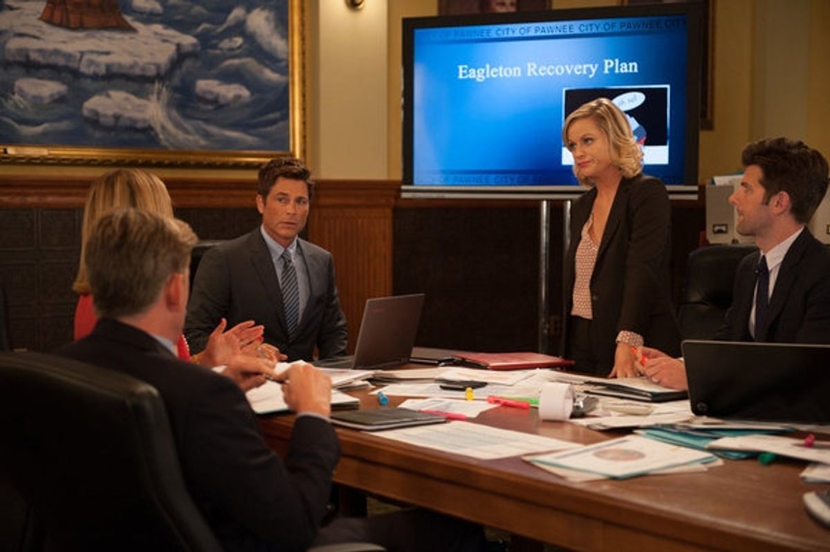 PARKS AND RECREATION -- ''The Pawnee-Eagleton Tip Off Classic'' Episode 603 -- Pictured: (l-r) Rob Lowe as Chris Traeger, Amy Poehler as Leslie Knope, Adam Scott as Ben Wyatt -- (Photo by: Colleen Hayes/NBC) at 