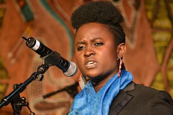 ACEC Motswana Poet TJ Dema Speaking at Poetry Africa Photo