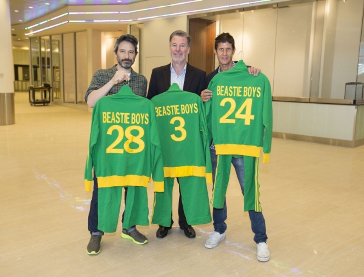 Adam Horovitz and Mike D of the Beastie Boys, former heavyweight champ Larry Holmes and former NY Knick Larry Johnson present Hank Ratner, President of The Madison Square Garden Company, with personal memorabilia for display in the new Signature Suites at at 