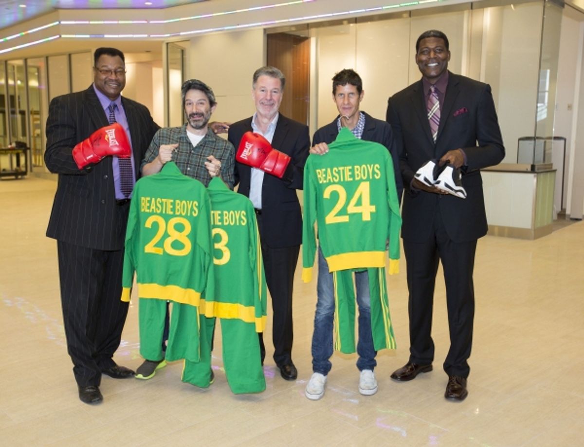 Adam Horovitz and Mike D of the Beastie Boys, former heavyweight champ Larry Holmes and former NY Knick Larry Johnson present Hank Ratner, President of The Madison Square Garden Company, with personal memorabilia for display in the new Signature Suites at at 