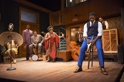 Ma Rainey (Tina Fabrique*) puts her trumpet player, Levee (Warner Miller*), in his pl Photo