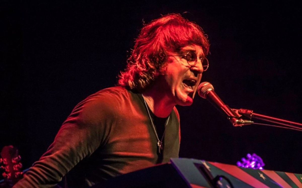 Tim Piper as John Lennon at 