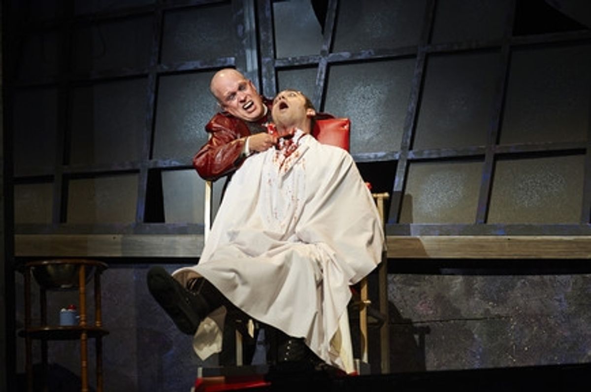 Actor Tom Ford (left, as Sweeney Todd) dispatches another victim, actor Alex Syiek (right)  at 