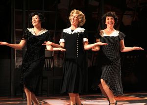 Emily A. Grodzik, Kym Chambers Otto, and Laurie Flanigan Hegge sing a jingle about th Photo