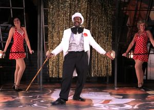 Ron Collier as William Allen and show girls (l to r) Emily A. Grodzik and Kym Chamber Photo