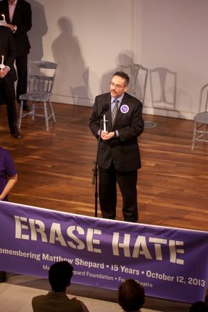 Rev. Dwayne Johnson leads an interfaith moment of silence. Photo
