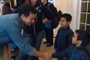 Actor Peter Sipla shakes hands with eight-year-old Zachary Uzarraga on the first day  Photo