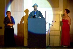 Kyrus Keenan Westcott, president of the Pennington Players, accepts the Community The Photo