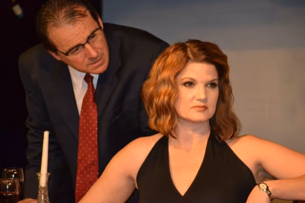Gerardo (Kevin Daugherty) tries to explain to Paulina (Malinda L. Beckham) why he is  Photo