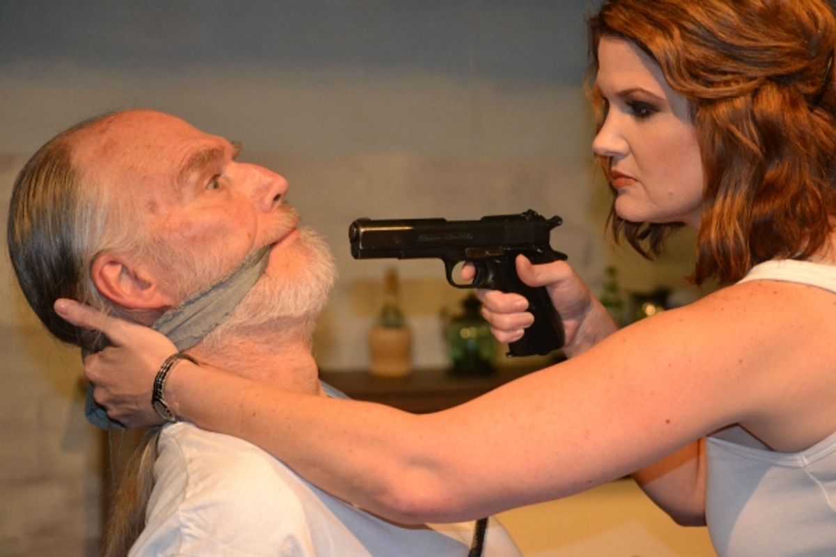 Paulina (Malinda L. Beckham) interrogates the captive Roberto (John Stevens). at 