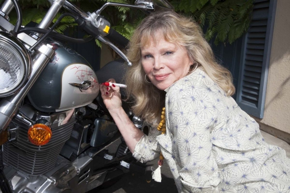 Marta Kristen (Lost in Space) signs bike
 at 