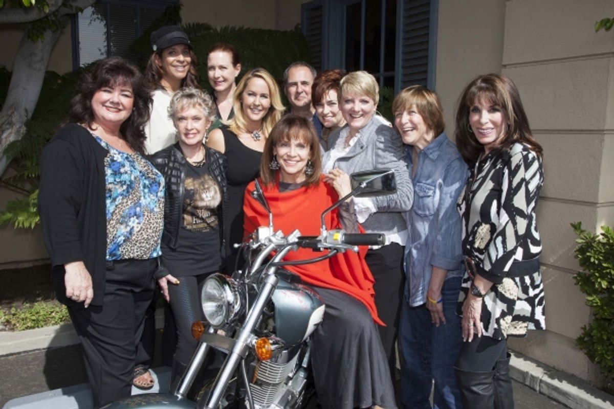 Tammy Locke, Christine Devine, Tippi Hedren, Katy Kurtzman, Erin Murphy, Valerie Harper, Grier Weeks, Carolyn Hennesy, Alison Arngrim, Geri Jewell and Kate Linder gather around Magaret Cho''s bike, signed for charity. at 