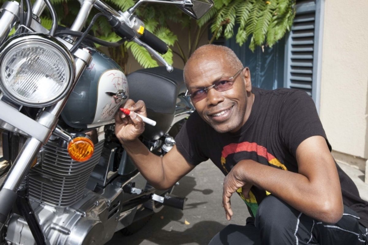 Ernest L. Thomas (What''s Happening) signs bike at 