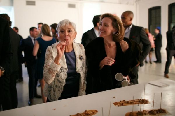 Sing for Hope Board Chair Eva Haller savors her s''mores at the After Party Photo