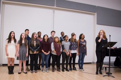 Katie Thompson (GIANT), backed by 13 students from the Professional Performing Arts S Photo
