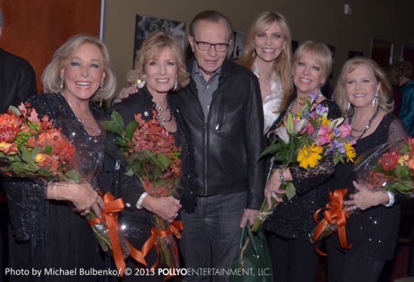 Celebrity guests Larry King and wife Shawn King congratulate vocal group The Four Kin Photo