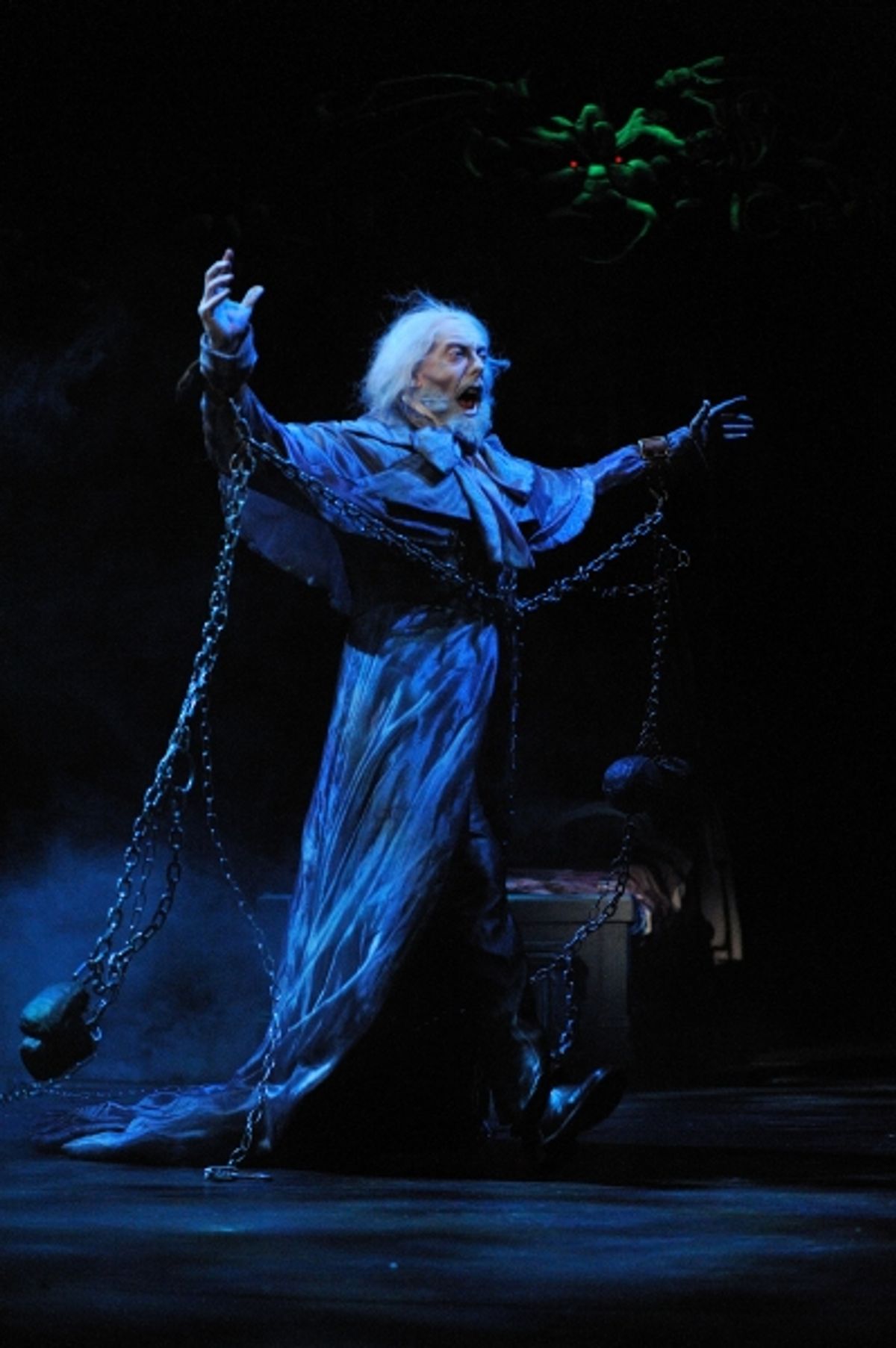 The Ghost of Jacob Marley (actor Lynn Robert Berg) warns Ebenezer Scrooge to change his ways  at 
