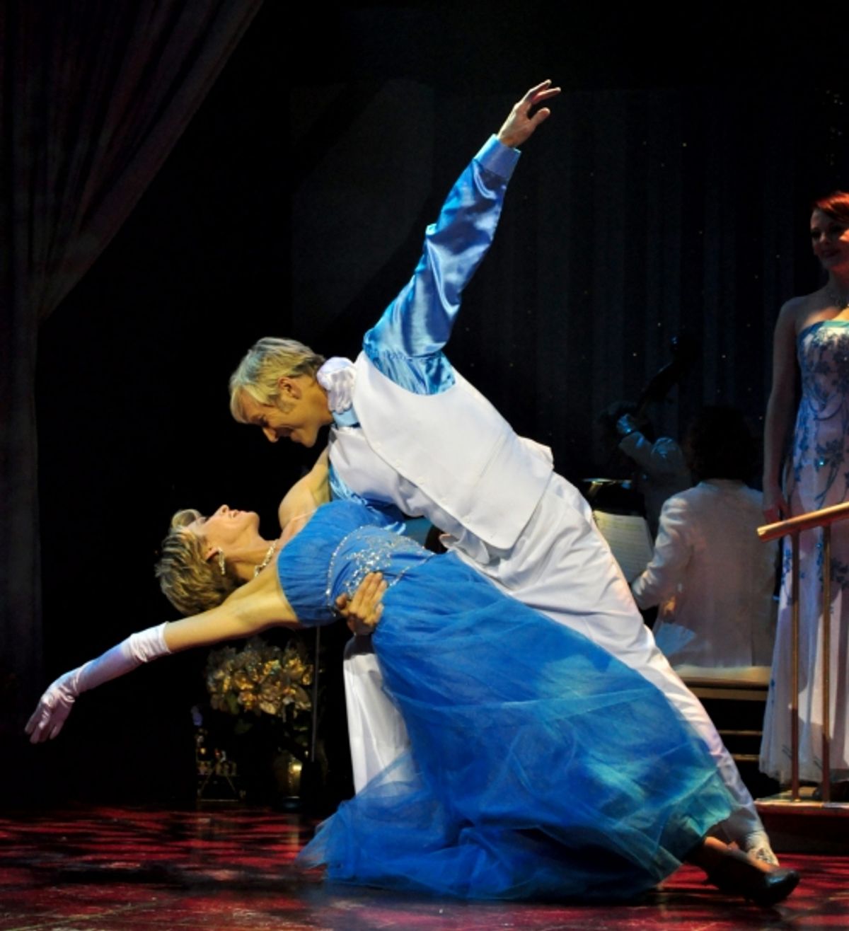 Co-hosts Deb Wims and Kenny Shepard perform their signature Christmas Waltz at 