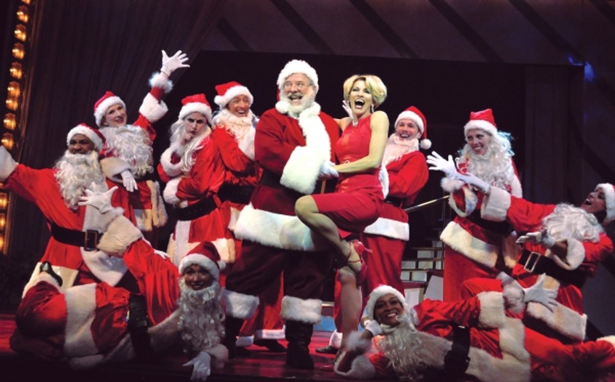 Deb Wims, center, finds the real Santa on a stage filled with imposters during the song ''Man With The Bag'' at 