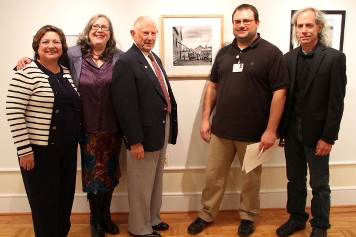 Best in Show winner was Jay Brandinger of Pennington, third from left, for his photo ''Threshing Wheat.'' He is pictured with, from left, Nora Ananos and Tricia Fagan of the Mercer County Cultural and Heritage Commission, Gallery Director Dylan Wolfe and  at 